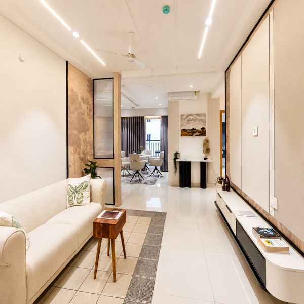 Modern living room, luxury living room, premium interior, contemporary home, elegant home interior, stylish apartment, luxury apartment, modern sofa, beige sofa, cozy seating area, living room furniture, modern TV unit, TV cabinet, wall paneling, decorative wall, wooden partition, glass partition, modern interior design, luxury interior design, minimalist interior, sophisticated home, premium home decor, contemporary decor, neutral color interior, beige interior, white interior, modern lighting, LED ceiling lights, false ceiling design, ceiling fan, ambient lighting, warm lighting, indoor plants, decorative accessories, wooden side table, area rug, designer furniture, spacious living room, open living space, apartment interior, residential interior, high-end home, aesthetic home, modern architecture, elegant decor, home styling, dream home, premium apartment interior, clean home design, beautiful living space.